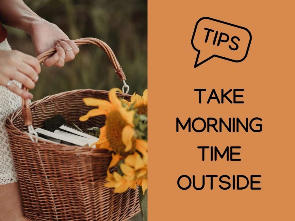 woman holding a basket of books with sunflowers and the words "tips: take morning time outside"