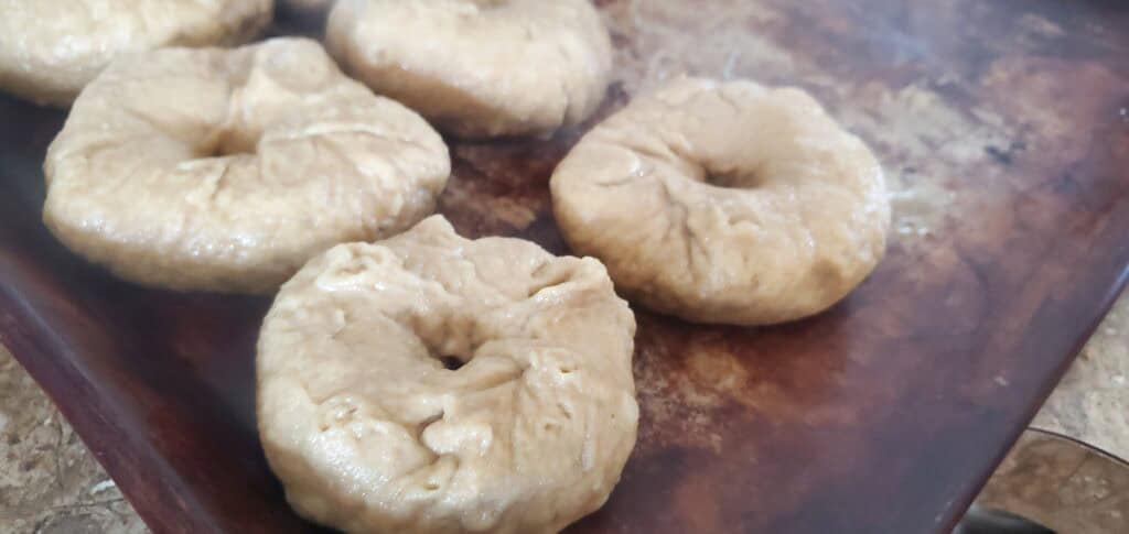 tray of bagels on stoneware after boiling